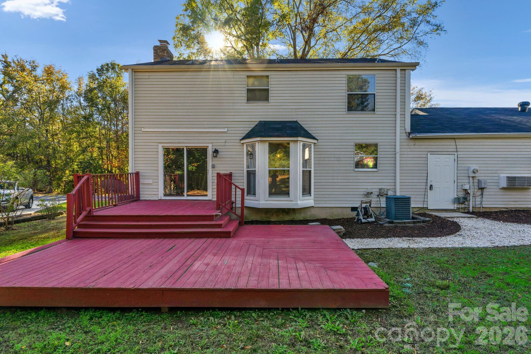 12006 Woodside Falls Road Pineville, NC 28134 - Photo 33 of 48 a front view of a house with a garden