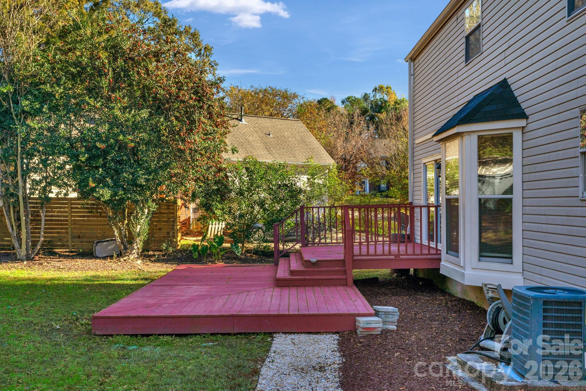 12006 Woodside Falls Road Pineville, NC 28134 - Photo 39 of 48 a view of a deck with a yard