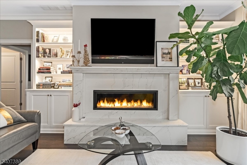 206 Echo Ridge Way, Unit 206 Mountainside, NJ 07092 - Photo 13 of 35 a living room with furniture a fireplace and a flat screen tv