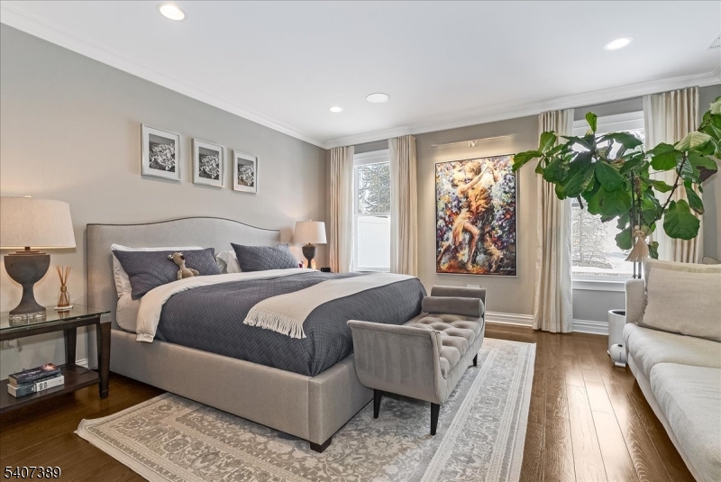 206 Echo Ridge Way, Unit 206 Mountainside, NJ 07092 - Photo 16 of 35 a bedroom with furniture and a large window