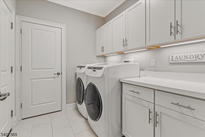 206 Echo Ridge Way, Unit 206 Mountainside, NJ 07092 - Photo 19 of 35 a utility room with dryer and washer