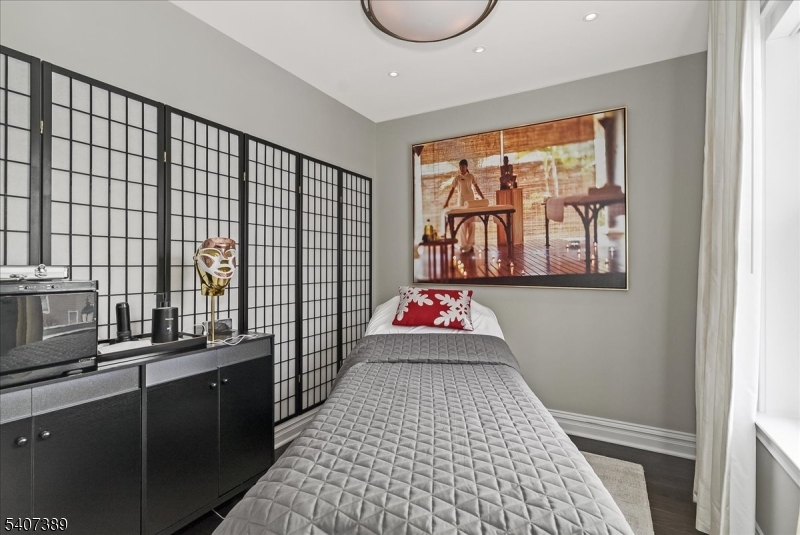 206 Echo Ridge Way, Unit 206 Mountainside, NJ 07092 - Photo 24 of 35 a room with a wooden floor and windows