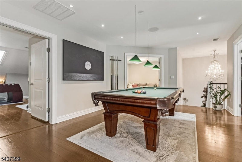 206 Echo Ridge Way, Unit 206 Mountainside, NJ 07092 - Photo 27 of 35 a room with furniture and wooden floor