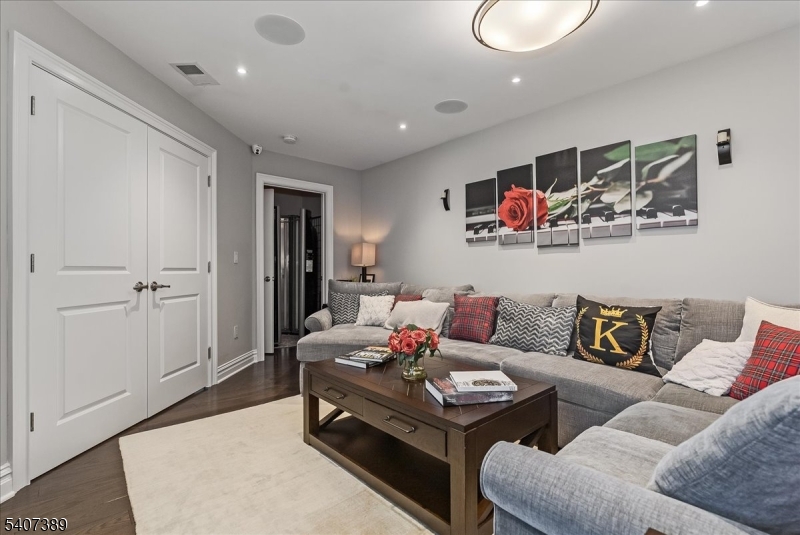 206 Echo Ridge Way, Unit 206 Mountainside, NJ 07092 - Photo 30 of 35 a living room with furniture and kitchen view
