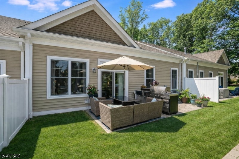 206 Echo Ridge Way, Unit 206 Mountainside, NJ 07092 - Photo 32 of 35 a view of a house with couches chairs and a yard