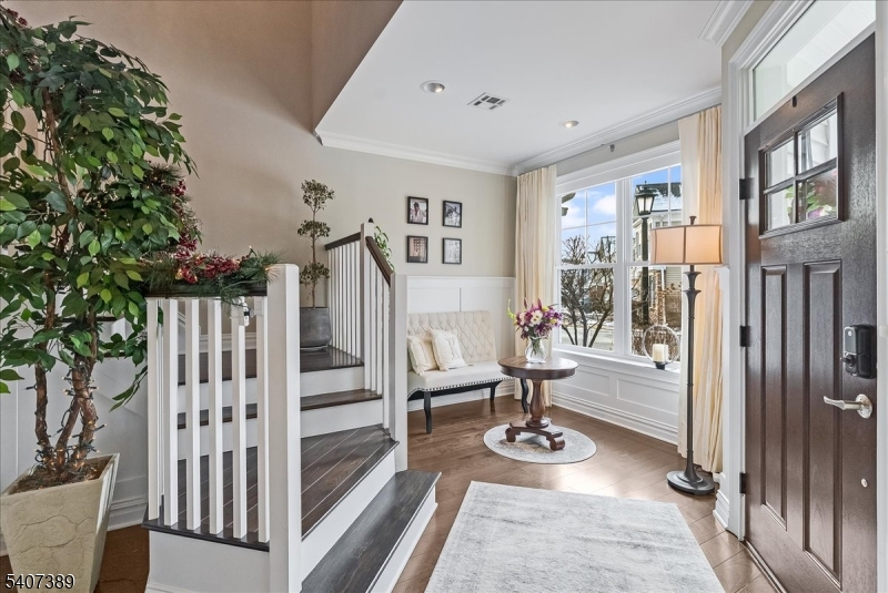 206 Echo Ridge Way, Unit 206 Mountainside, NJ 07092 - Photo 4 of 35 a view of living room filled with furniture and wooden floor