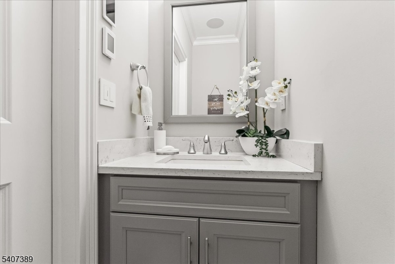 206 Echo Ridge Way, Unit 206 Mountainside, NJ 07092 - Photo 5 of 35 a bathroom with a sink and a mirror