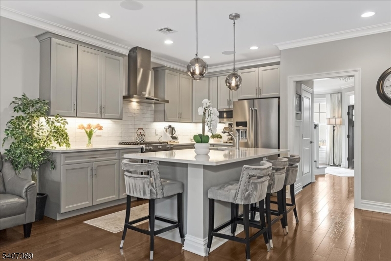 206 Echo Ridge Way, Unit 206 Mountainside, NJ 07092 - Photo 8 of 35 a kitchen with kitchen island granite countertop a sink cabinets and refrigerator