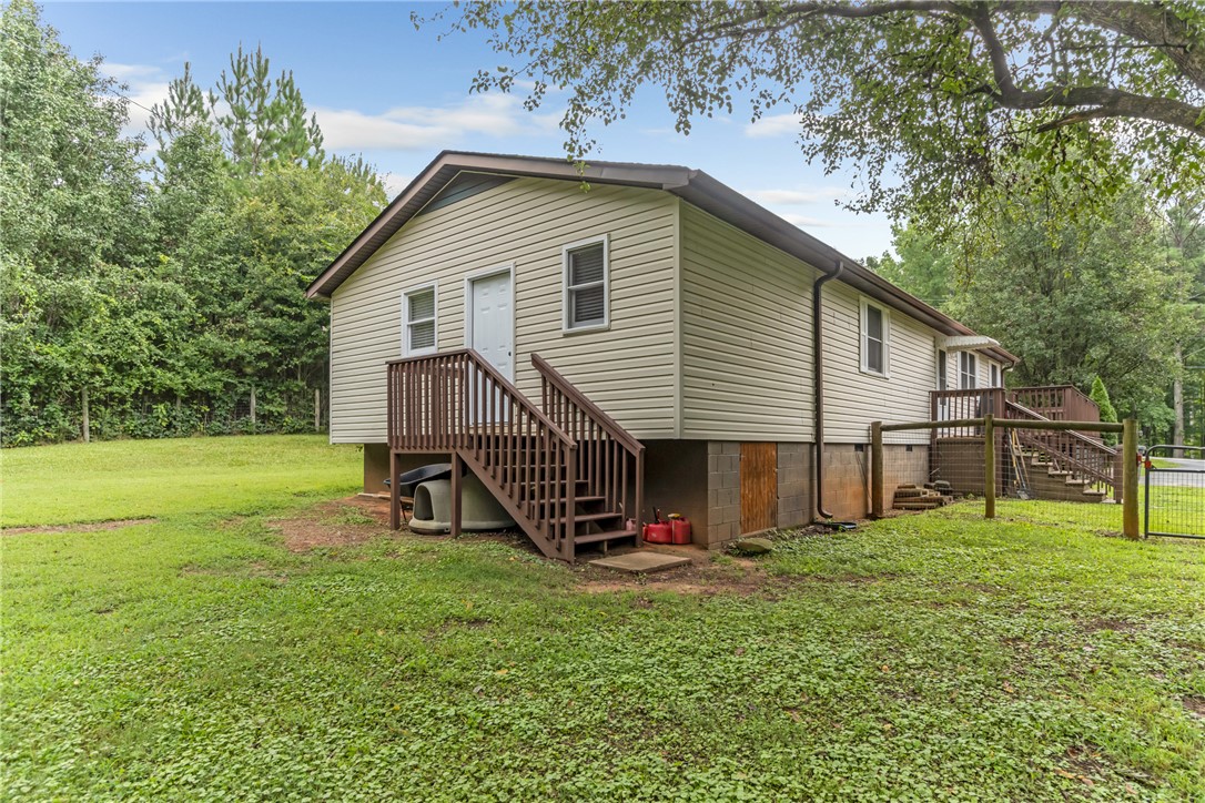 404 Davis Road Liberty, SC 29657 - Photo 35 of 39 A classic ranch home nestled among abundant greenery offers comfortable living with a welcoming exterior.