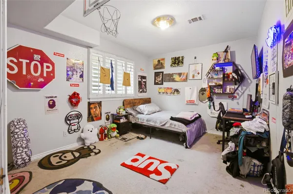 a bedroom with furniture and a window