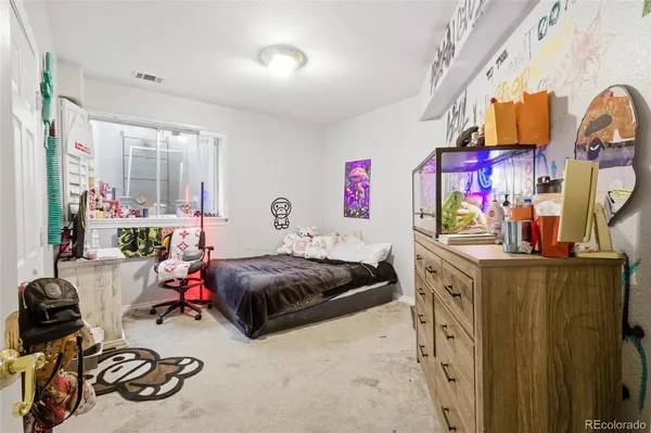 a bedroom with bed and a window