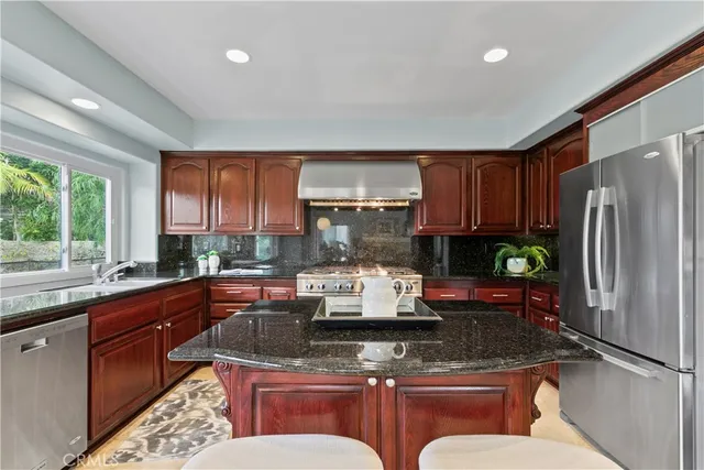 a bathroom with a double vanity sink mirror and bathtub