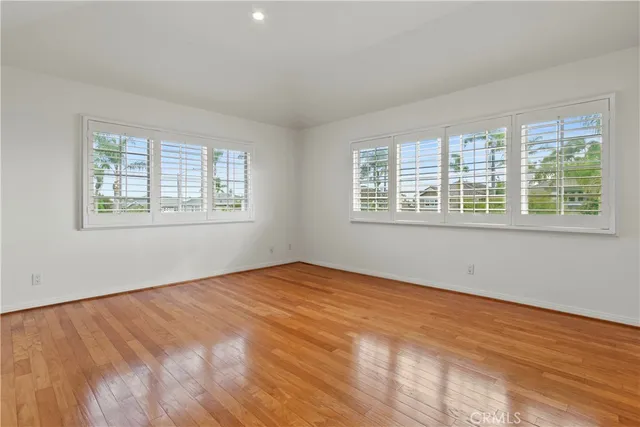 a view of a city with lush green forest