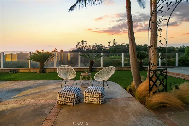 a view of a balcony with yard