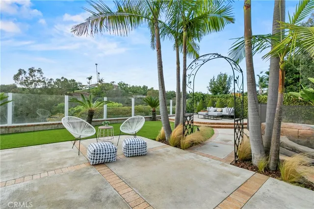 an aerial view of residential houses with outdoor space and street view