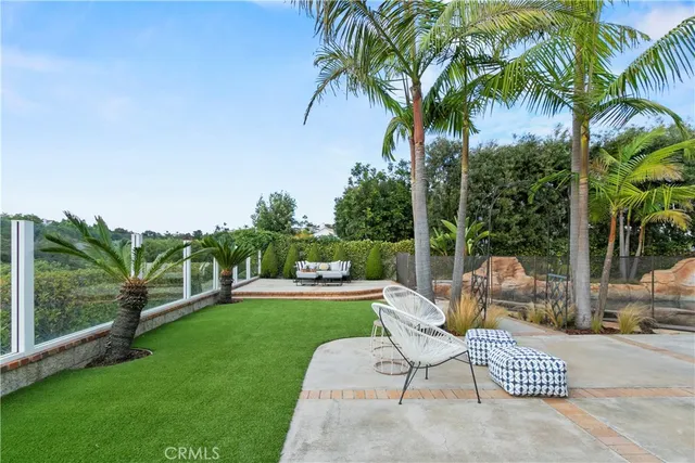 an aerial view of residential houses with yard