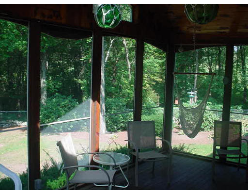 23 Mc Intosh Road Chelmsford, MA 01824 - Photo 11 of 11 a view of a chairs and table in patio
