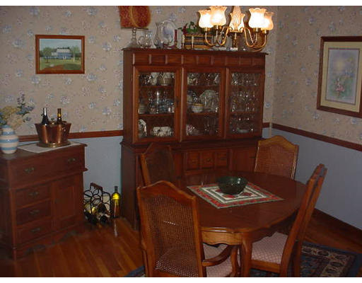 23 Mc Intosh Road Chelmsford, MA 01824 - Photo 3 of 11 a view of a dining room with furniture and chandelier