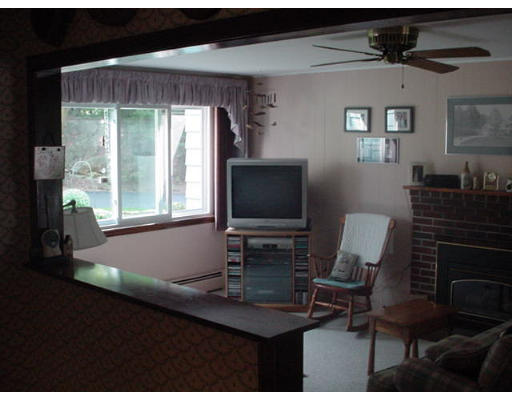 23 Mc Intosh Road Chelmsford, MA 01824 - Photo 5 of 11 a room with furniture and a window