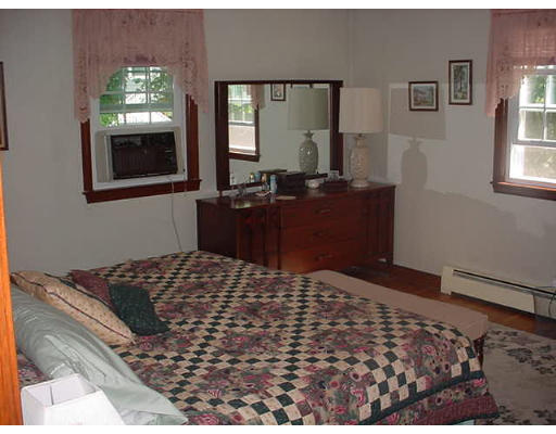 23 Mc Intosh Road Chelmsford, MA 01824 - Photo 7 of 11 a bedroom with a bed and a dresser