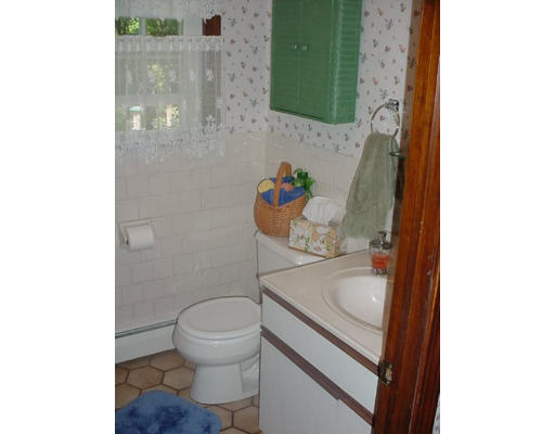 23 Mc Intosh Road Chelmsford, MA 01824 - Photo 9 of 11 a bathroom with a sink and a toilet