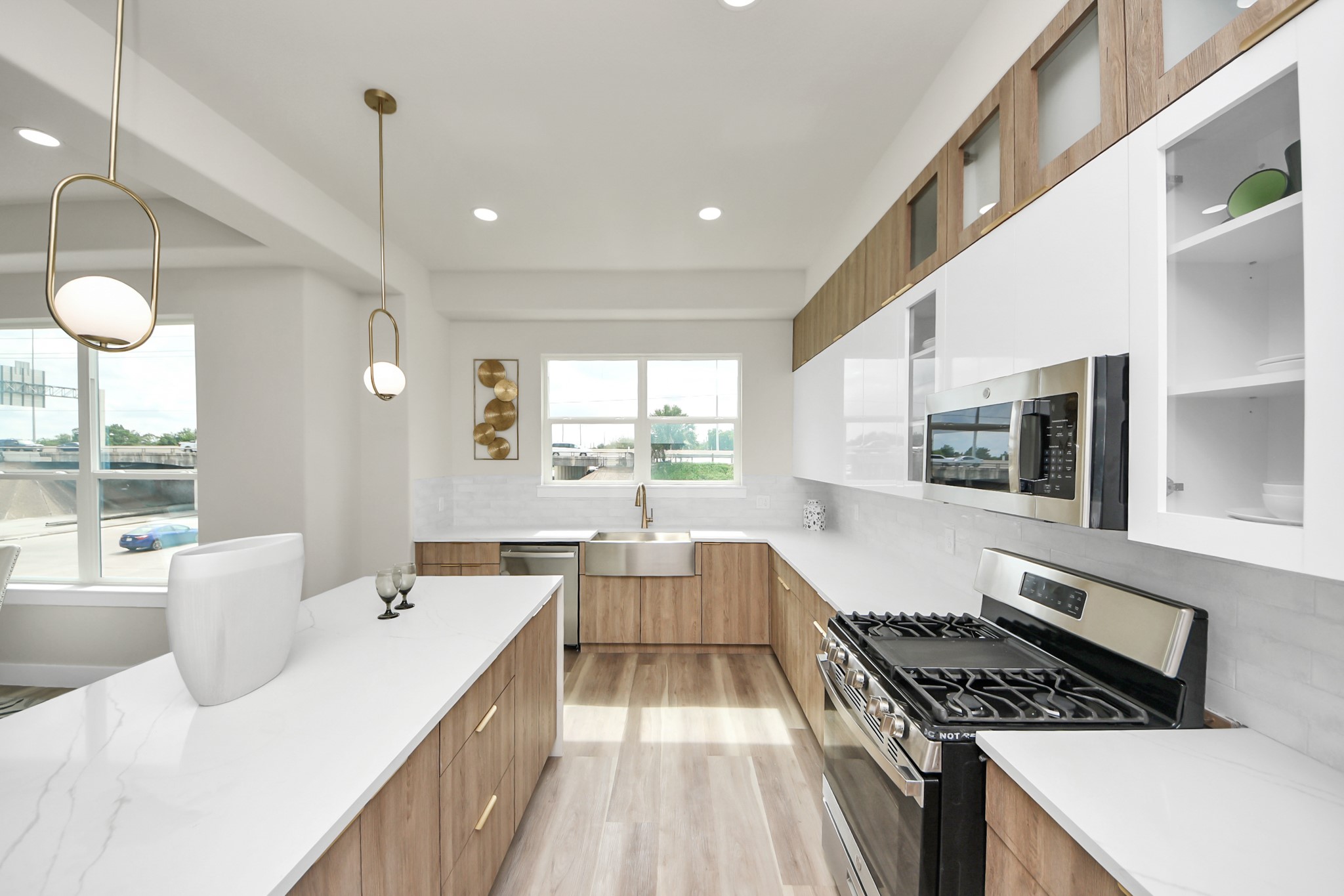 2014 Blodgett Street Houston, TX 77004 - Photo 18 of 49 a large kitchen with kitchen island a large counter space a large window and stainless steel appliances