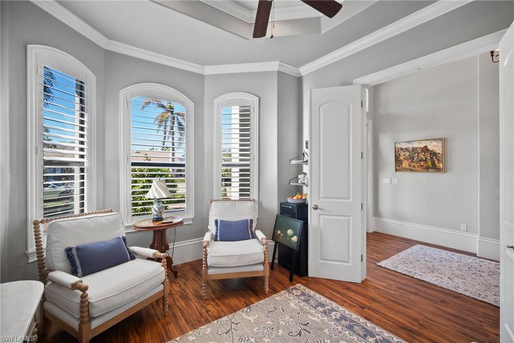 10340 Vanderbilt Drive Naples, FL 34108 - Photo 30 of 45 a living room with furniture and a window