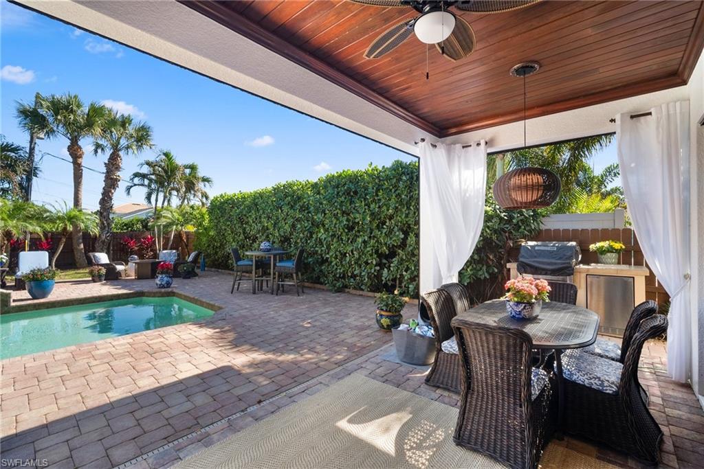 10340 Vanderbilt Drive Naples, FL 34108 - Photo 40 of 45 a outdoor space with furniture
