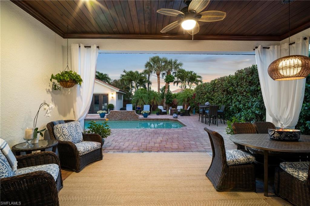 10340 Vanderbilt Drive Naples, FL 34108 - Photo 5 of 45 a living room with furniture and a potted plant
