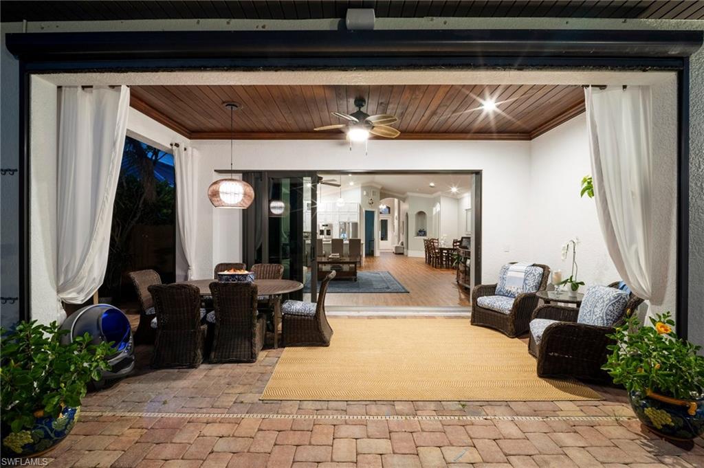 10340 Vanderbilt Drive Naples, FL 34108 - Photo 8 of 45 a living room with furniture