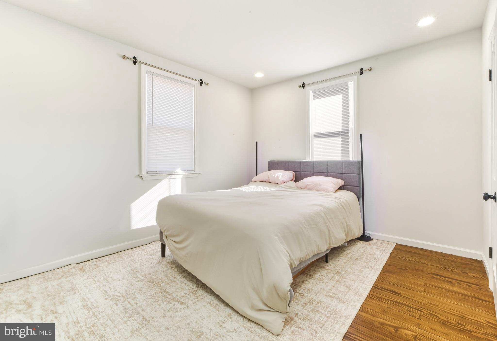 1287 Clements Bridge Road Woodbury, NJ 08096 - Photo 9 of 16 a bedroom with a bed and a window