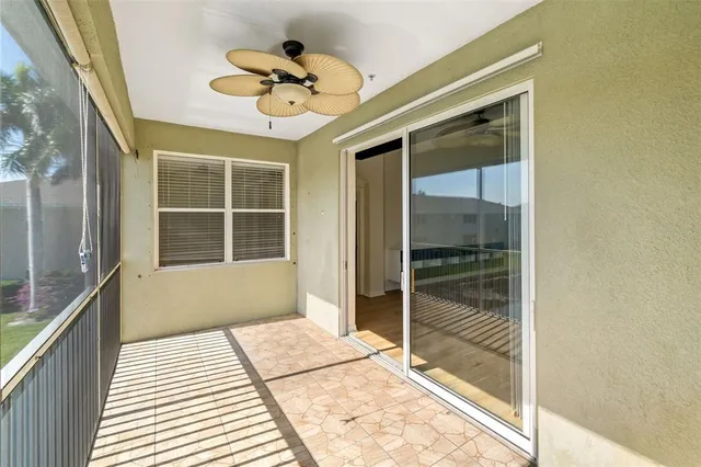 a view of a balcony with a ceiling fan