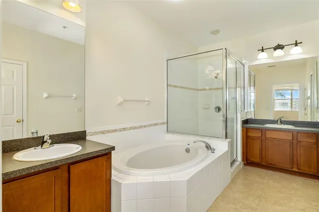 a bathroom with a granite countertop sink mirror and double