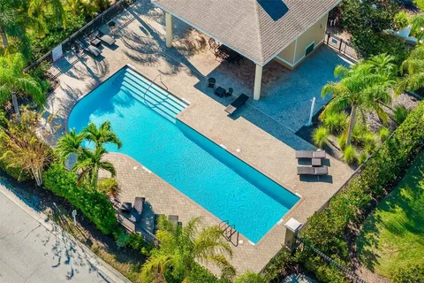 a view of a swimming pool with a patio