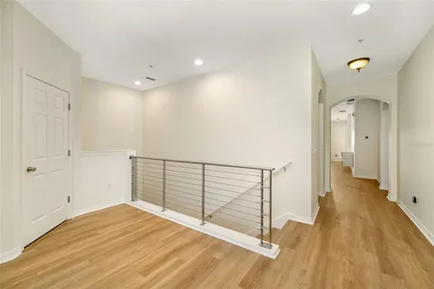 a view of a room with wooden floor