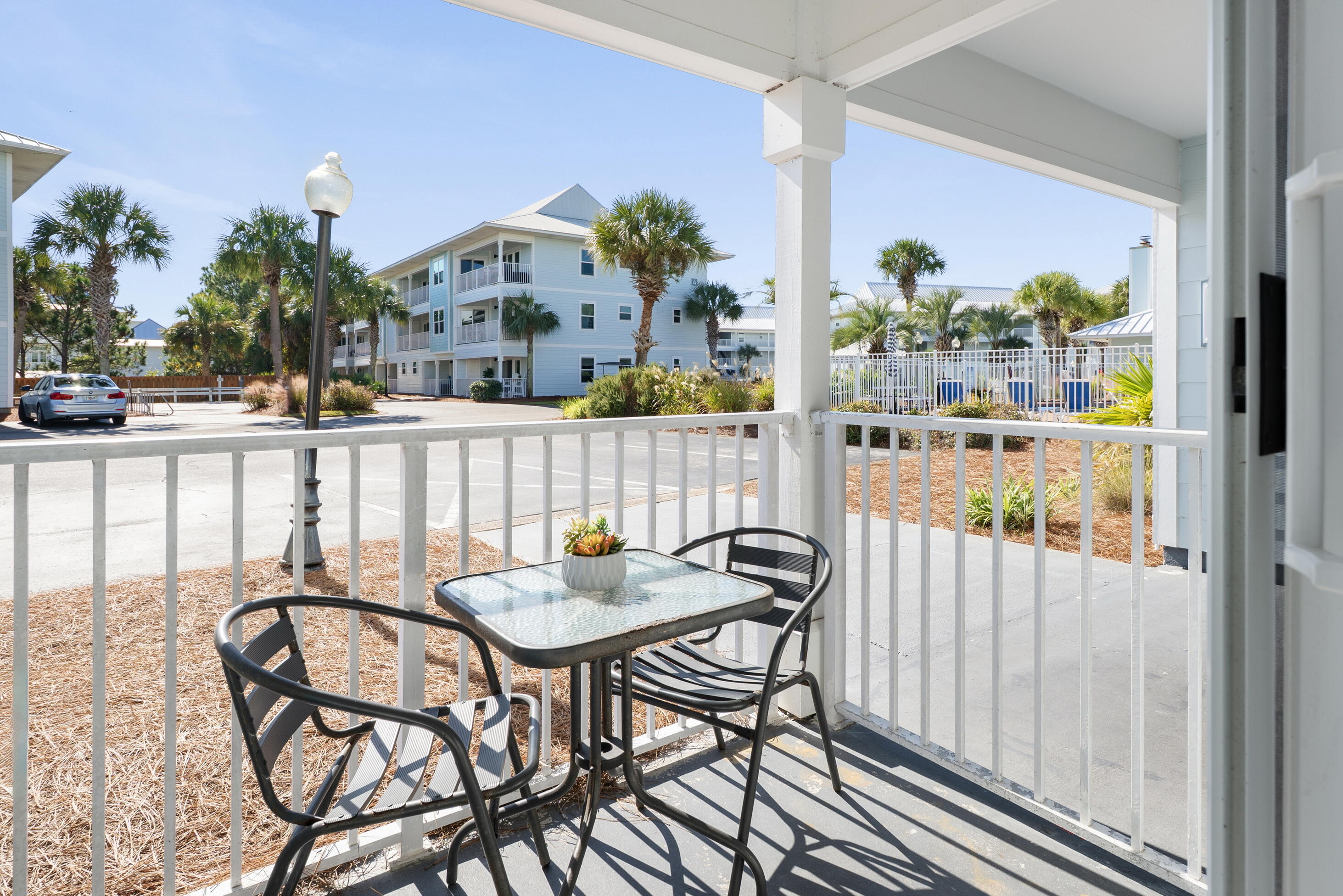 11 Beachside Drive, Unit 912 Santa Rosa Beach, FL 32459 - Photo 15 of 58 a view of a chairs and table in patio