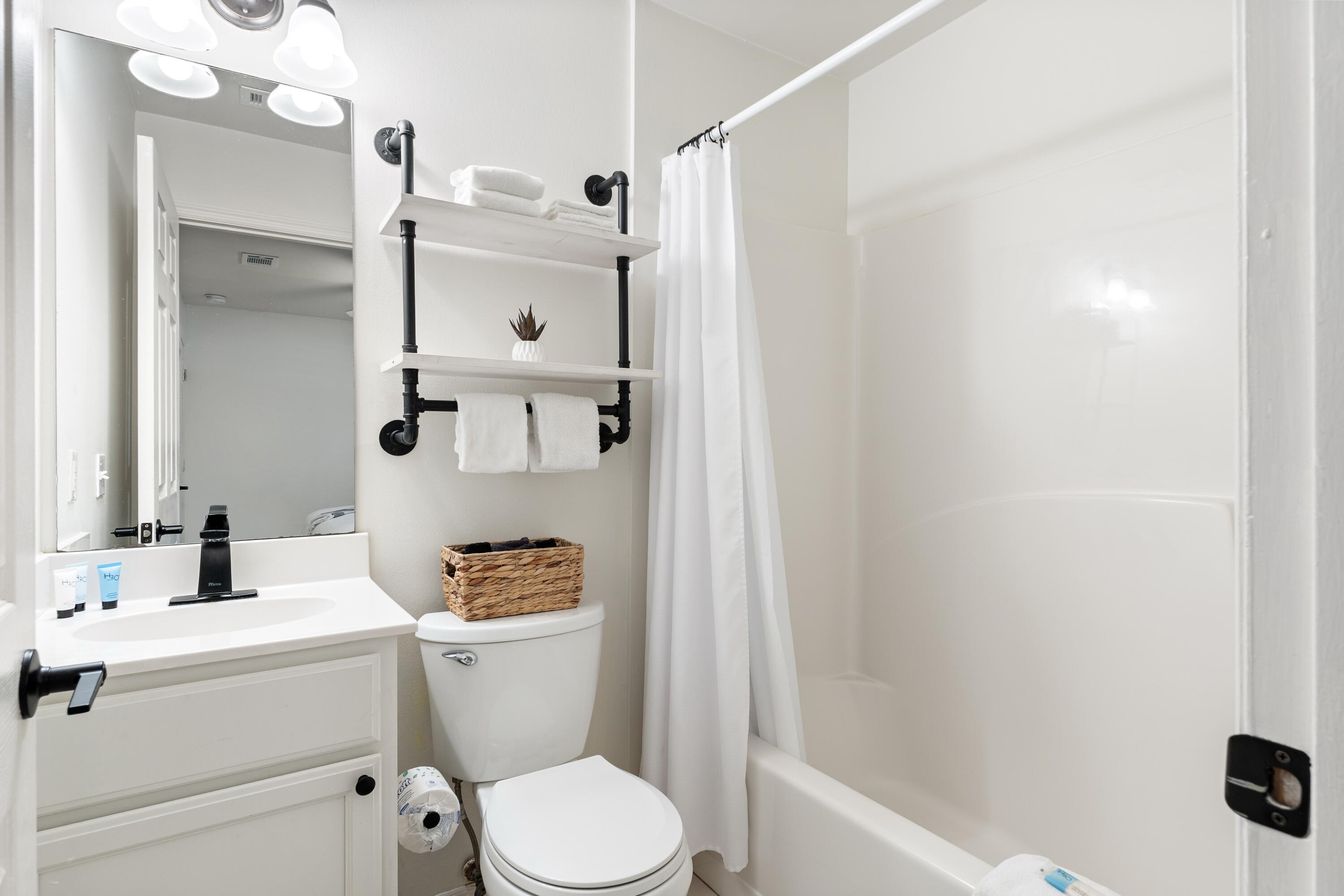 11 Beachside Drive, Unit 912 Santa Rosa Beach, FL 32459 - Photo 24 of 58 a bathroom with a sink a toilet and shower curtain