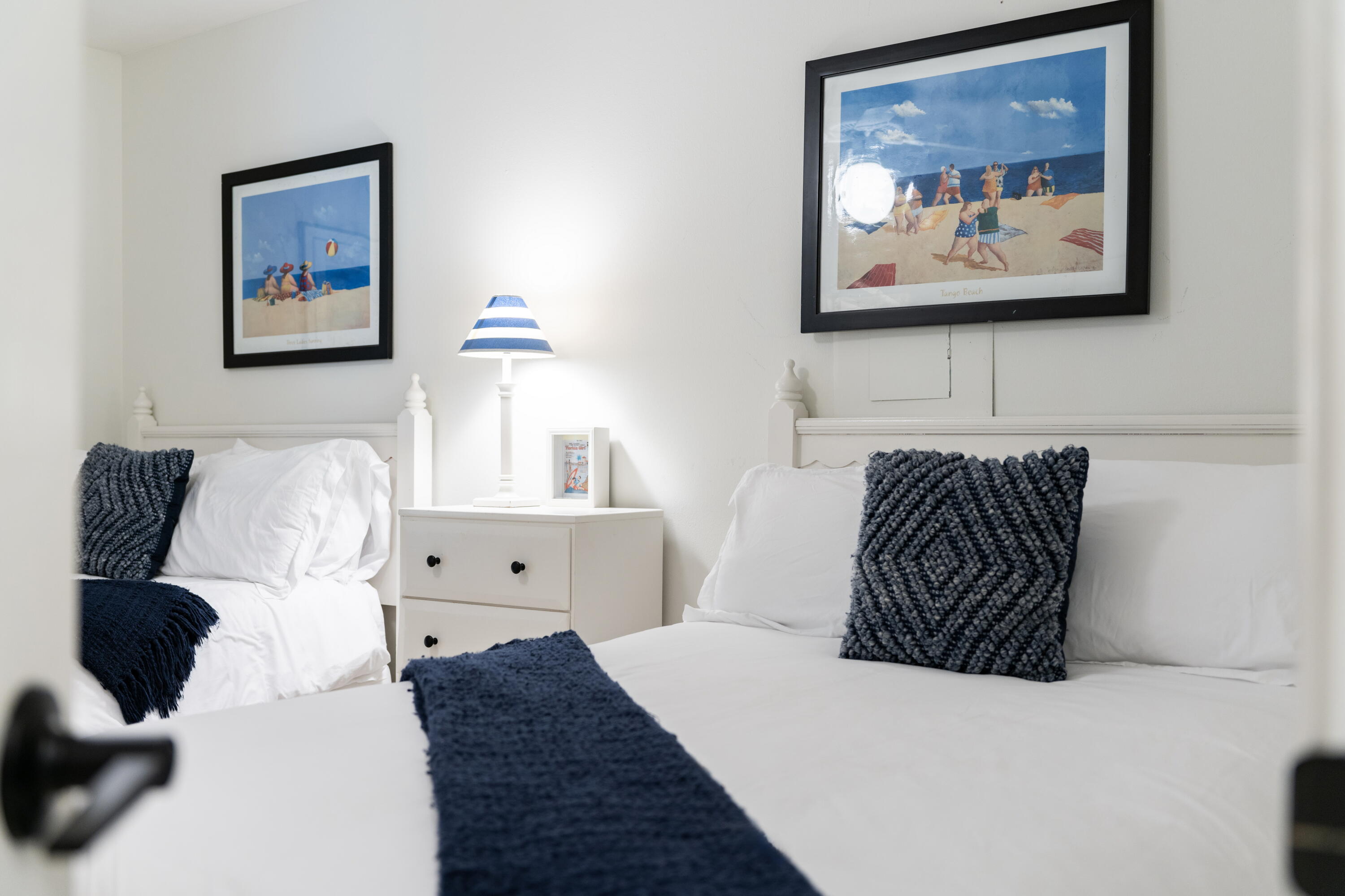 11 Beachside Drive, Unit 912 Santa Rosa Beach, FL 32459 - Photo 26 of 58 a bedroom with a bed and wall painting