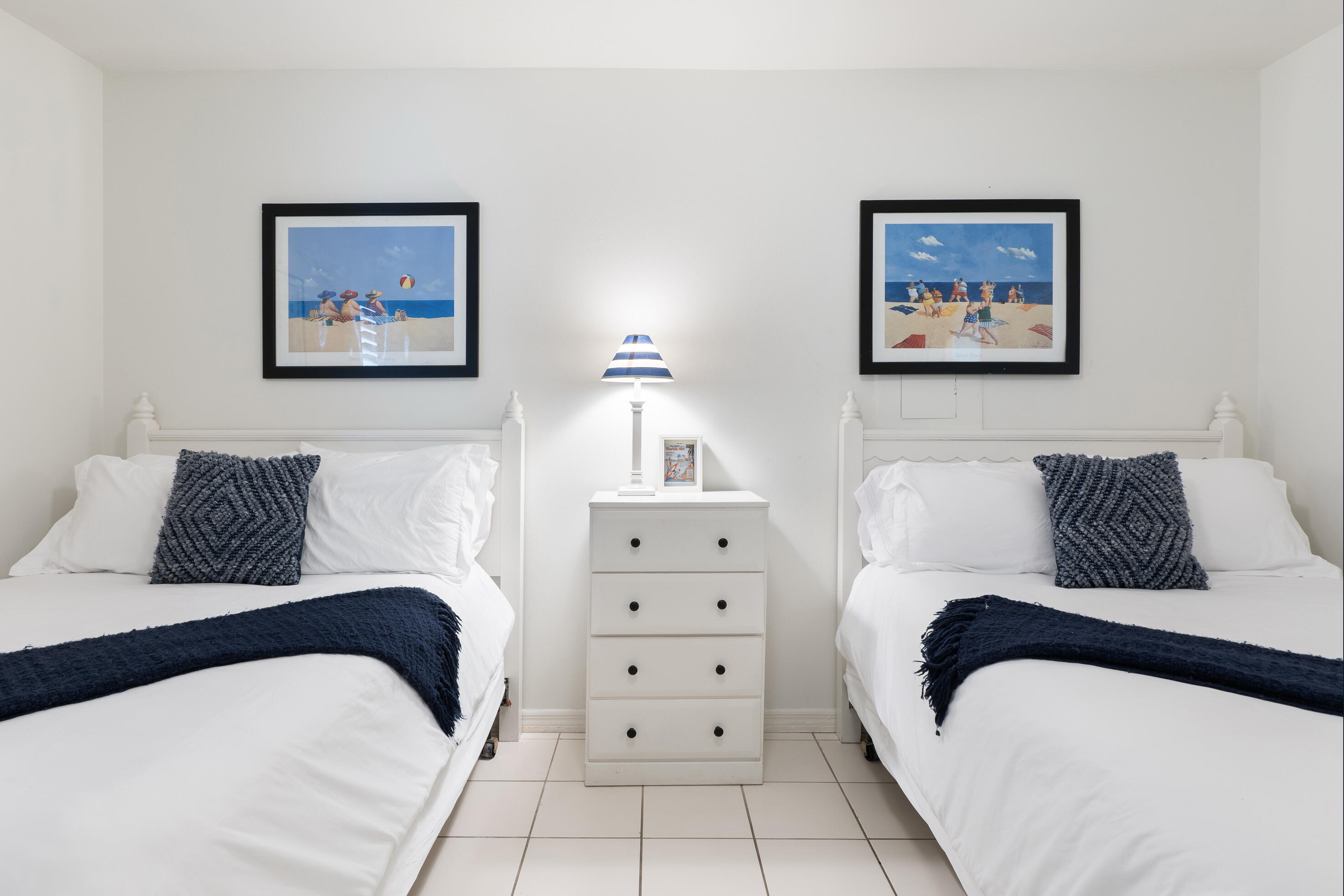 11 Beachside Drive, Unit 912 Santa Rosa Beach, FL 32459 - Photo 28 of 58 a bedroom with a bed and a lamp on dresser