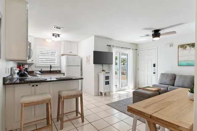 a kitchen with stainless steel appliances kitchen island granite countertop a sink and cabinets