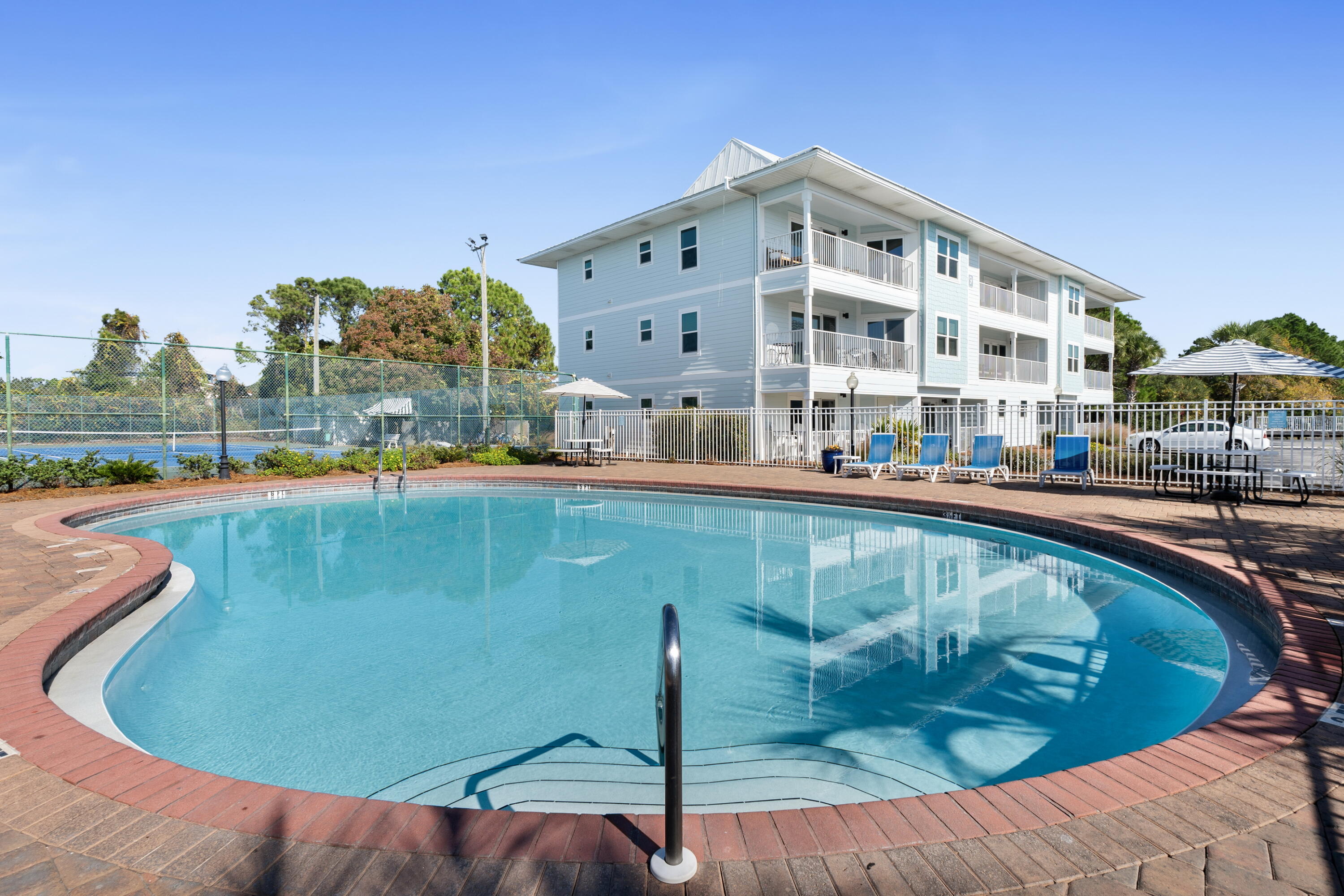 11 Beachside Drive, Unit 912 Santa Rosa Beach, FL 32459 - Photo 32 of 58 a view of a swimming pool with outdoor seating and plants