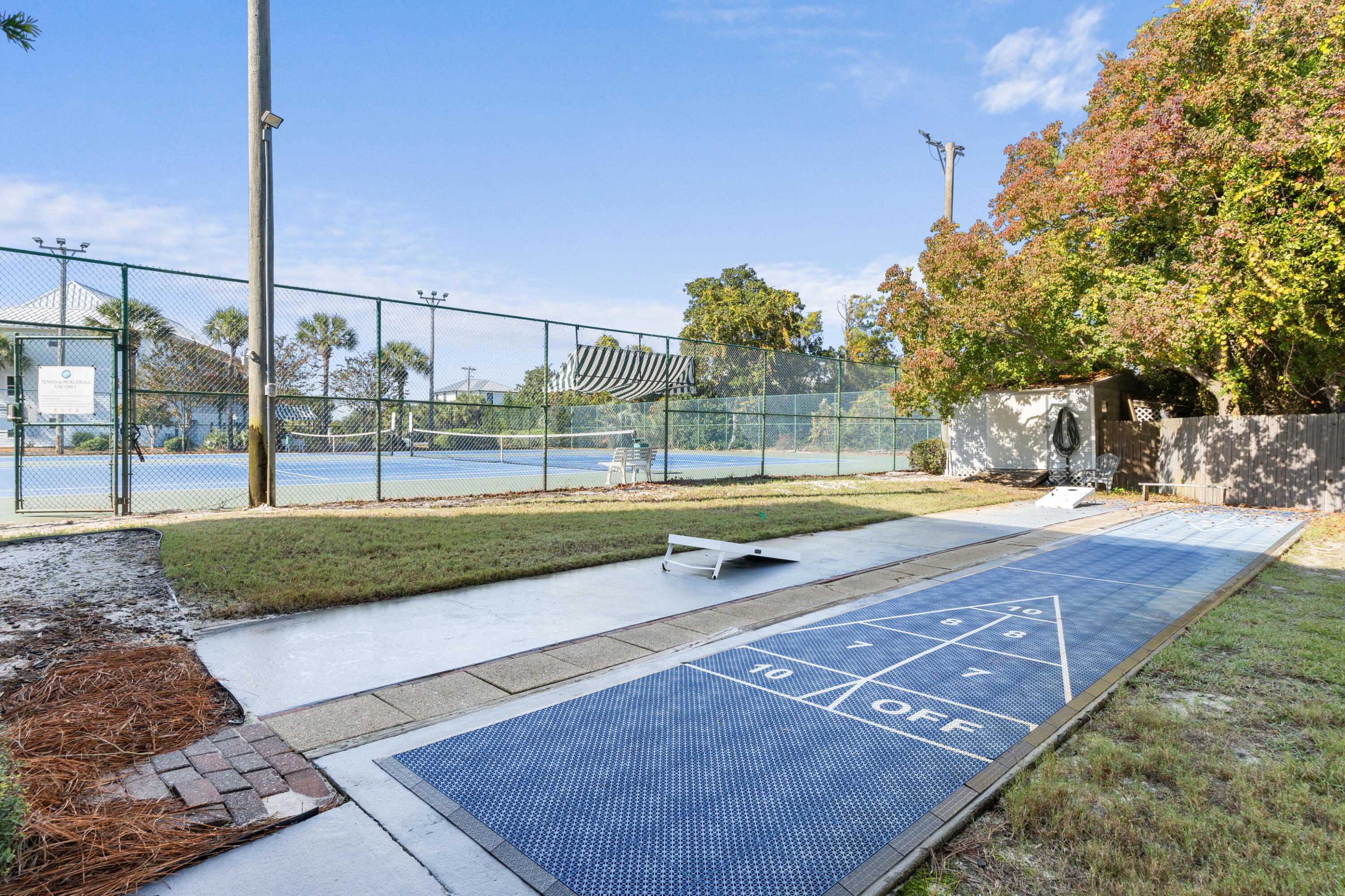 11 Beachside Drive, Unit 912 Santa Rosa Beach, FL 32459 - Photo 38 of 58 a view of a tennis ground with a large trees