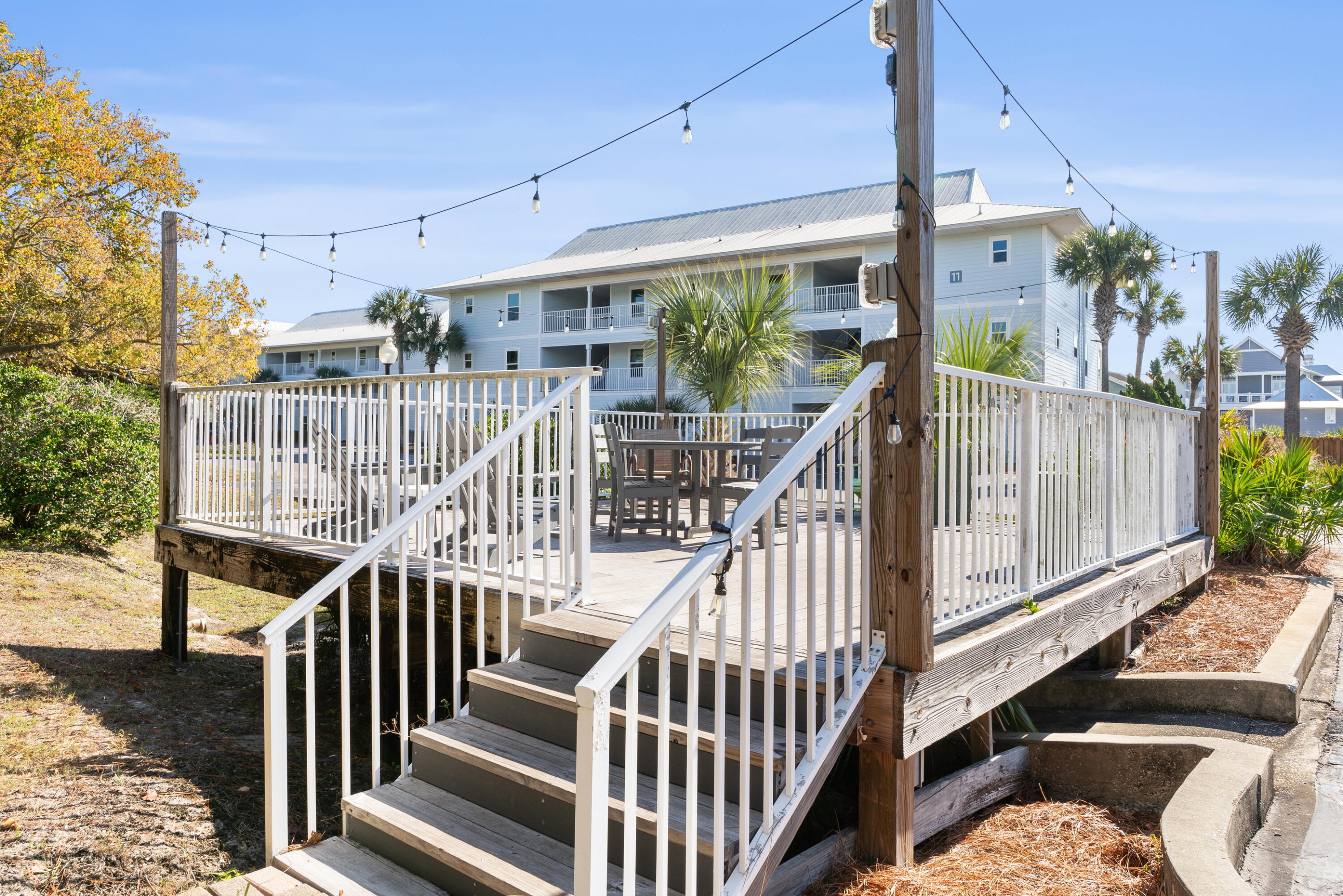 11 Beachside Drive, Unit 912 Santa Rosa Beach, FL 32459 - Photo 47 of 58 a view of balcony with wooden floor and outdoor seating