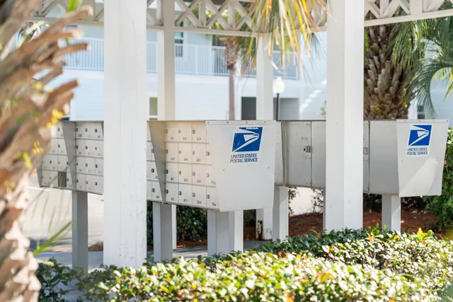 a wooden sign that is on the side of a road