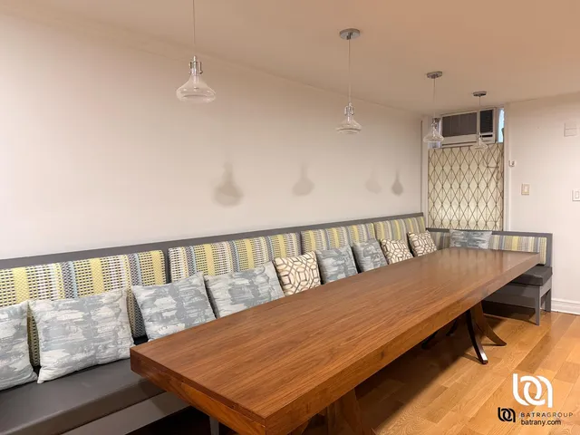 a view of a living room and a wooden floor