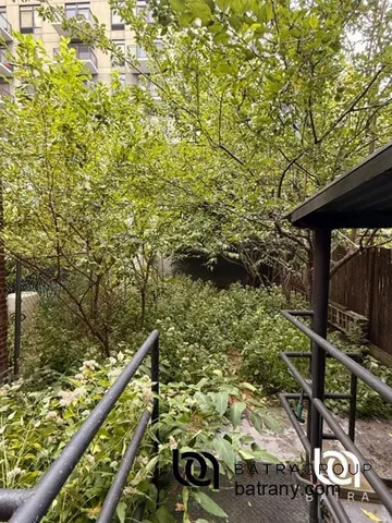 a view of balcony with wooden floor