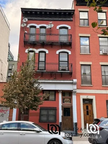 a front view of a building with many windows