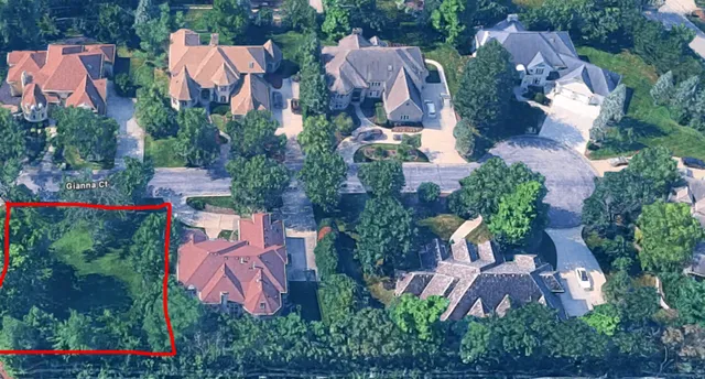 an aerial view of residential house with outdoor space and swimming pool