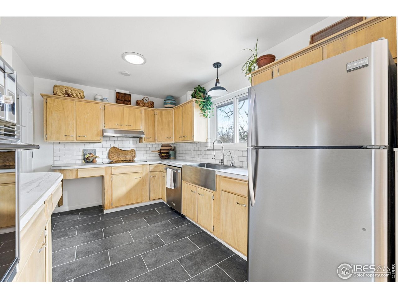 2204 Purdue Road Fort Collins, CO 80525 - Photo 11 of 50 With plenty of light, , counter space and storage, this kitchen is a delight to cook in