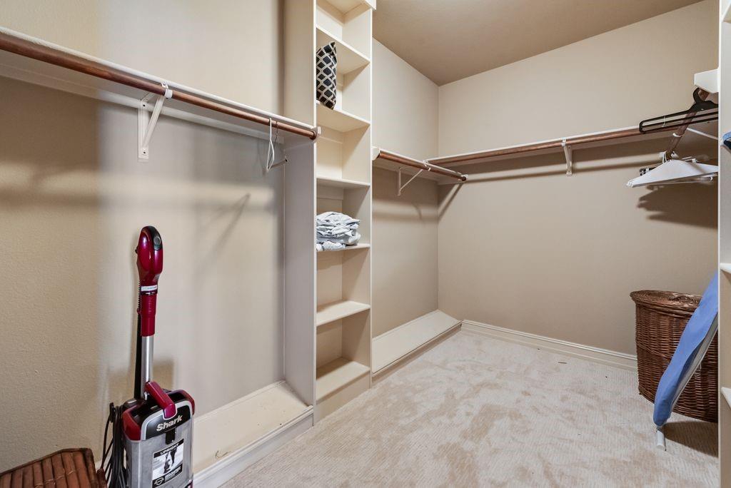 13026 Rudy's Way Streetman, TX 75859 - Photo 19 of 40 The massive walk in closet provides more than enough space to stash away all your wardrobe without sacrificing space in the bedroom.